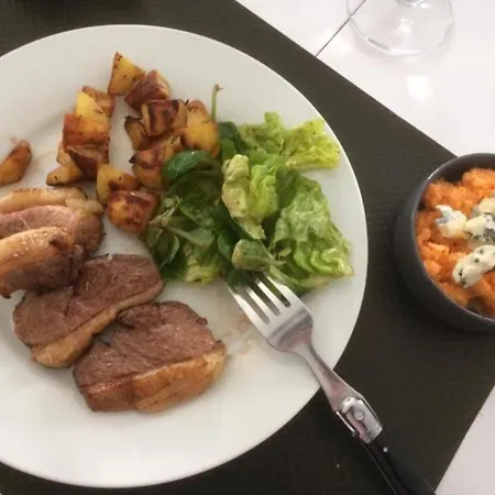 Alojamento de Acomodação e Pequeno-almoço D'hotes Au Bougainvillier